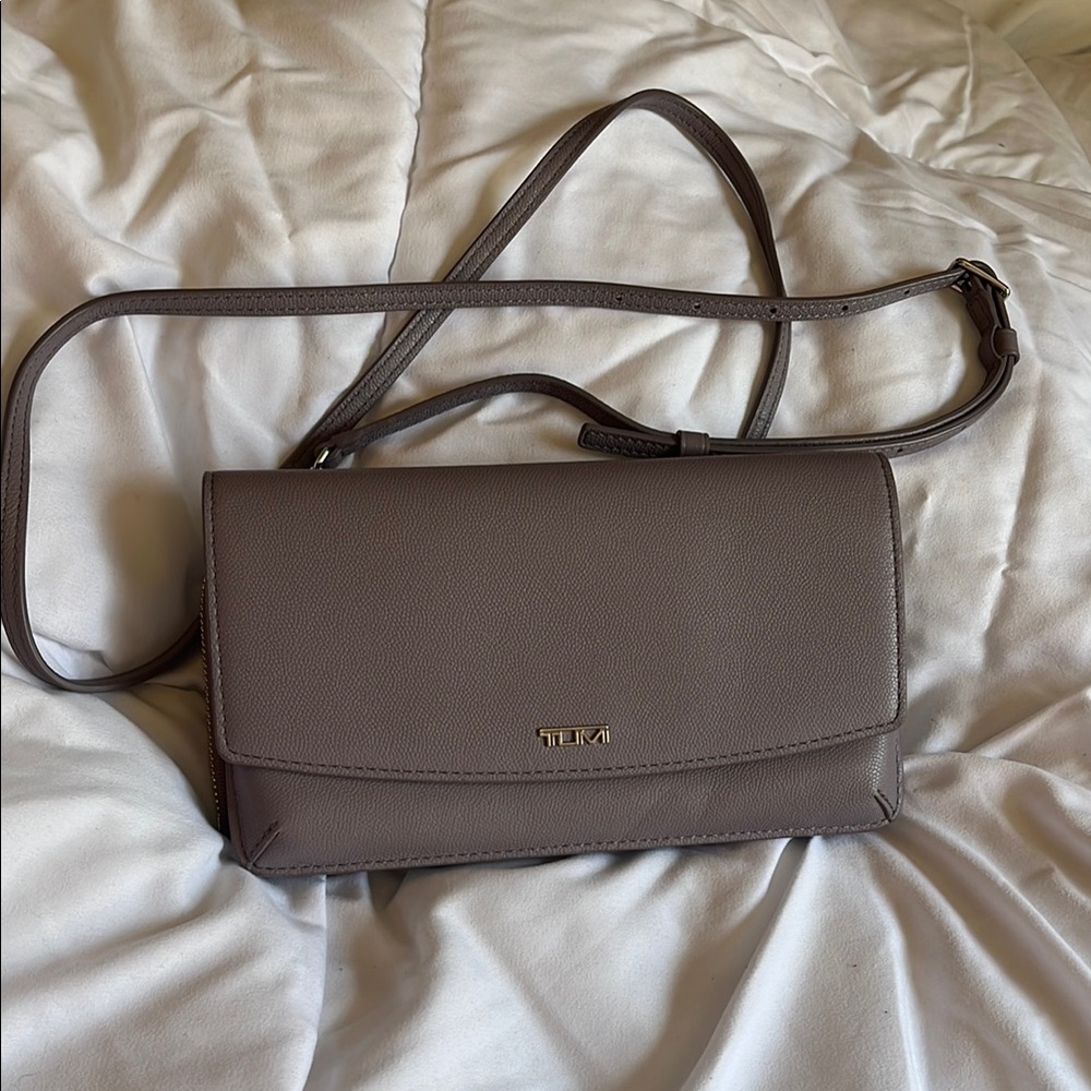 Tumi light purple Crossbody Bag with Flap Closure